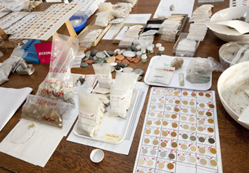 A desk with rock-samples and sample holders.