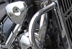 Detail of a motorcycle from the front - light and part of the engine block